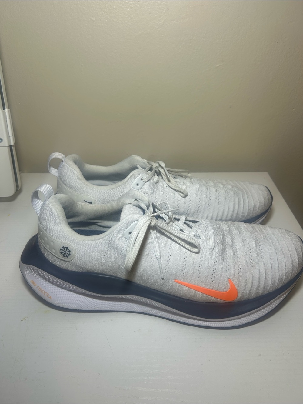 Nike Men’s White Athletic Shoes with Orange Swoosh